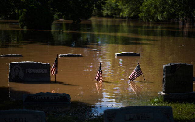 Headstones at a cemetery that flooded in Somerville, N.J. September 2, 2021. (AP Photo/Eduardo Munoz Alvarez) Headstones at a cemetery that flooded in Somerville, N.J. September 2, 2021. (AP Photo/Eduardo Munoz Alvarez)