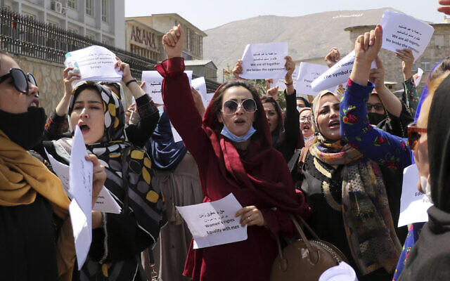 Women gather to demand their rights under the Taliban rule during a protest in Kabul, Afghanistan, Friday, Sept. 3, 2021. (AP Photo/Wali Sabawoon) Women gather to demand their rights under the Taliban rule during a protest in Kabul, Afghanistan, Friday, Sept. 3, 2021. (AP Photo/Wali Sabawoon)