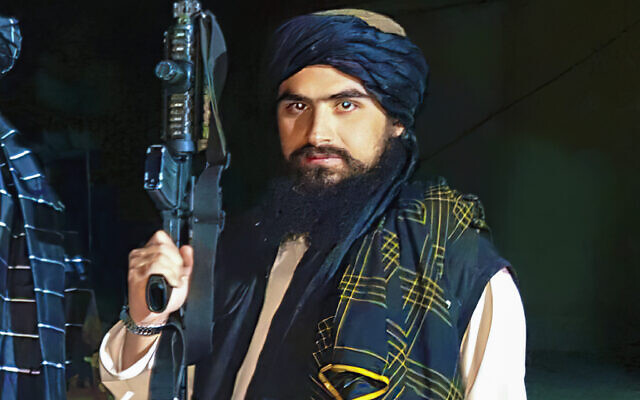 In this undated image, Hemad Sherzad, holding his M-4 rifle, poses for a photo outside of Hamid Karzai International Airport in Kabul, Afghanistan. (Courtesy of Hamed Sherzad via AP)