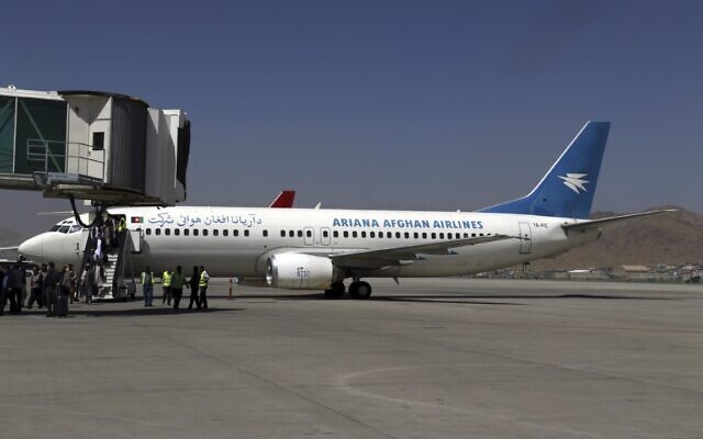 Passengers disembark as they arrive from Kandahar, at Hamid Karzai International Airport in Kabul, Afghanistan, Sunday, Sept. 5, 2021. Some domestic flights have resumed at Kabul's airport, with the state-run Ariana Afghan Airlines operating flights to three provinces. (AP Photo/Wali Sabawoon) Passengers disembark as they arrive from Kandahar, at Hamid Karzai International Airport in Kabul, Afghanistan, Sunday, Sept. 5, 2021. Some domestic flights have resumed at Kabul's airport, with the state-run Ariana Afghan Airlines operating flights to three provinces. (AP Photo/Wali Sabawoon)