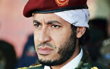 In this undated file photo made available on Sept. 25, 2011, al-Saadi Gaddafi, son of the late Libyan leader Moammar Gaddafi, watches a military exercise by the elite military unit commanded by his brother, Khamis, in Zlitan, Libya (AP Photo/Abdel Magid al-Fergany, File)