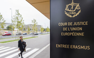 In this file photo taken October 5, 2015 a woman walks by the entrance to the European Court of Justice in Luxembourg (AP/Geert Vanden Wijngaert)