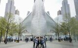 Visitors peek into the museum at the 9/11 Museum & Memorial, Thursday, April 29, 2021, in New York (AP Photo/Mary Altaffer, File)
