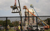 Crews remove one of the country's largest remaining monuments to the Confederacy, a towering statue of Confederate General Robert E. Lee on Monument Avenue in Richmond, Virginia, September 8, 2021. (AP/Steve Helber)