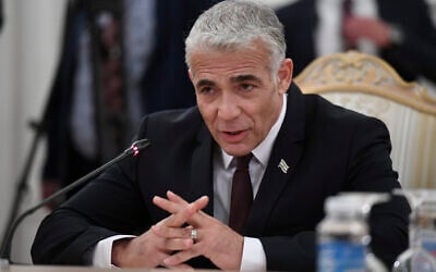 Israeli Foreign Minister Yair Lapid gestures as he speaks to Russian Foreign Minister Sergey Lavrov during their meeting in Moscow, Russia, Sept. 9, 2021. (Alexander Nemenov/Pool Photo via AP)