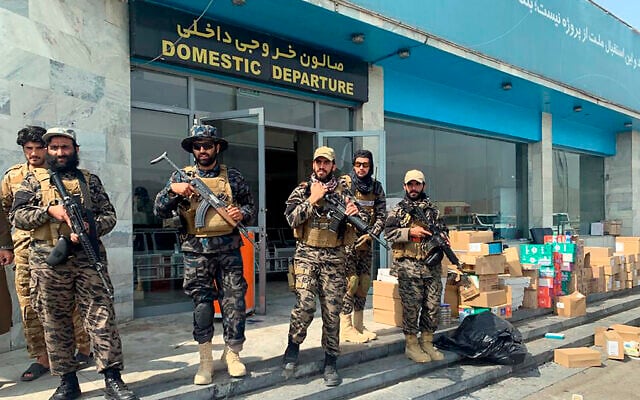 Illustrative: Taliban fighters stand guard inside the Hamid Karzai International Airport after the US withdrawal in Kabul, Afghanistan, August 31, 2021. (AP Photo/Kathy Gannon) Illustrative: Taliban fighters stand guard inside the Hamid Karzai International Airport after the US withdrawal in Kabul, Afghanistan, August 31, 2021. (AP Photo/Kathy Gannon)
