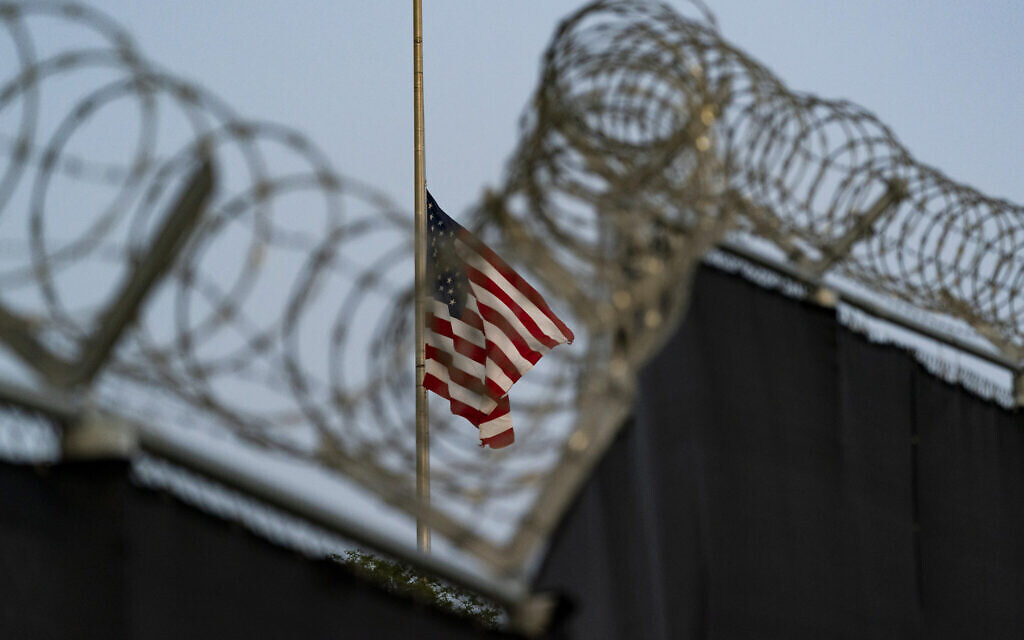 In this August 29, 2021, file photo reviewed by US military officials, a flag flies at half-staff in honor of the US service members and other victims killed in the terrorist attack in Kabul, Afghanistan, as seen from Camp Justice in Guantanamo Bay Naval Base, Cuba. (AP/Alex Brandon, File) In this August 29, 2021, file photo reviewed by US military officials, a flag flies at half-staff in honor of the US service members and other victims killed in the terrorist attack in Kabul, Afghanistan, as seen from Camp Justice in Guantanamo Bay Naval Base, Cuba. (AP/Alex Brandon, File)
