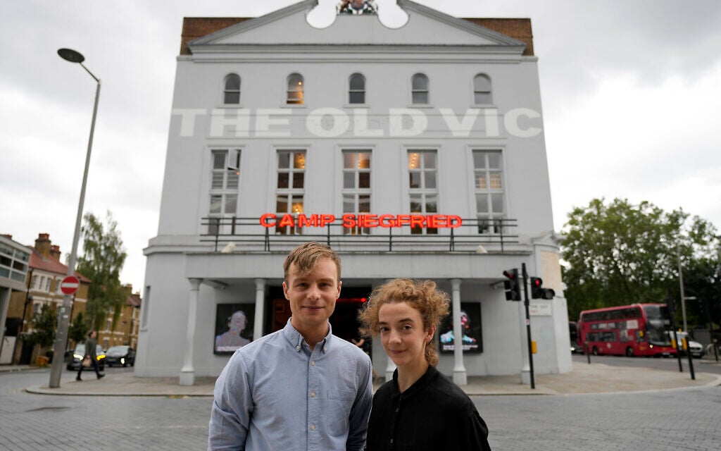 Actors Patsy Ferran, right and Luke Thallon, stars of the play Camp Siegfried, pose for a photographer in front of the Old Vic theatre in London, Friday, Sept. 10, 2021. (AP Photo/Frank Augstein) Actors Patsy Ferran, right and Luke Thallon, stars of the play Camp Siegfried, pose for a photographer in front of the Old Vic theatre in London, Friday, Sept. 10, 2021. (AP Photo/Frank Augstein)