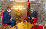 Morocco's King Mohammed VI, right, receives Aziz Akhannouch the president of the National Rally of Independents party (RNI), winner of the legislative elections at the Royal Palace in Fez, Morocco, September 10, 2021. (Moroccan Royal Palace via AP)