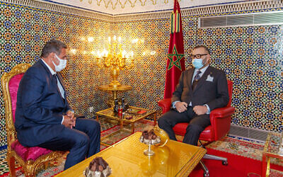 Morocco's King Mohammed VI, right, receives Aziz Akhannouch the president of the National Rally of Independents party (RNI), winner of the legislative elections at the Royal Palace in Fez, Morocco, September 10, 2021. (Moroccan Royal Palace via AP)
