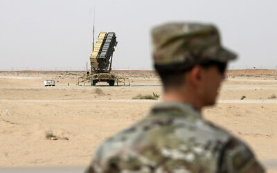 A member of the US Air Force stands near a Patriot missile battery at Prince Sultan Air Base in Saudi Arabia, February 20, 2020. (Andrew Caballero-Reynolds/Pool via AP, File)