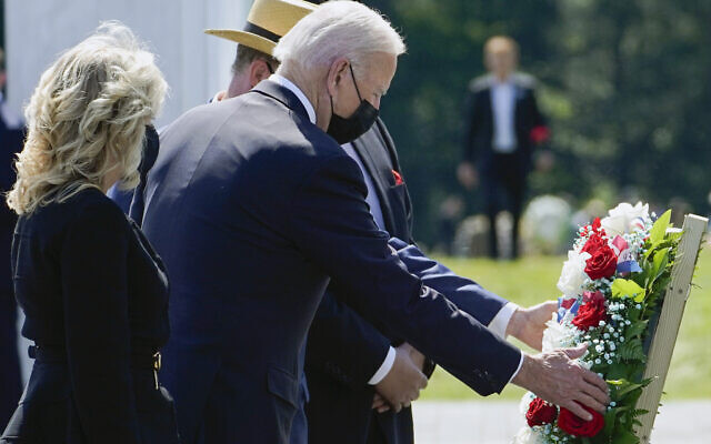 US President Joe Biden and first lady Jill Biden lay a wreath at the Wall of Names during a visit to the Flight 93 National Memorial in Shanksville, PA, on September 11, 2021. (AP Photo/Evan Vucci)