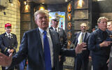 Former president Donald Trump visits the Engine Co. 8 firehouse where he praised first responders' bravery while criticizing President Joe Biden over the pullout from Afghanistan, Saturday Sept. 11, 2021, in New York. (AP Photo/Jill Colvin)