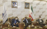 Director General of International Atomic Energy Agency Rafael Mariano Grossi (center) speaks with Deputy Head of the Atomic Energy Organization of Iran, Behrouz Kamalvandi (left) upon his arrival at Tehran Imam Khomeini International Airport, Iran, on September 11, 2021. (Atomic Energy Organization of Iran via AP)