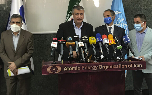 The head of the Atomic Energy Organization of Iran, Mohammad Eslami (center) speaks during a joint press briefing with Director General of International Atomic Energy Agency Rafael Mariano Grossi (second right) in Tehran, Iran, on Sunday, September 12, 2021. (Atomic Energy Organization of Iran via AP) The head of the Atomic Energy Organization of Iran, Mohammad Eslami (center) speaks during a joint press briefing with Director General of International Atomic Energy Agency Rafael Mariano Grossi (second right) in Tehran, Iran, on Sunday, September 12, 2021. (Atomic Energy Organization of Iran via AP)