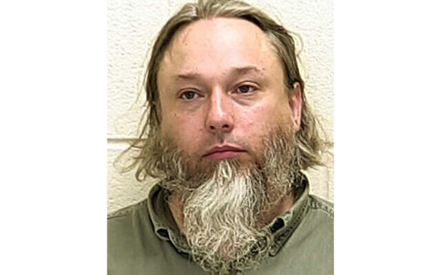 This undated file photo provided by The Ford County Sheriff's Office in Paxton, Ill., shows Michael Hari, a militia leader convicted of master­minding the bombing of a Minnesota mosque. (Ford County Sheriff's Office via AP File)