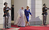 Pope Francis, flanked by Slovakian President Zuzana Caputova, right, attends a welcoming ceremony at the presidential palace in Bratislava, Slovakia, Monday, Sept. 13, 2021. (AP Photo/Gregorio Borgia)