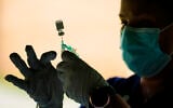 A syringe is prepared with the Pfizer COVID-19 vaccine at a clinic at the Reading Area Community College in Reading, Pennsylvania, September 14, 2021. (AP/ Matt Rourke)