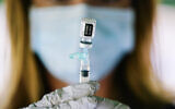 A syringe is prepared with the Pfizer COVID-19 vaccine at a clinic at the Reading Area Community College in Reading, Pennsylvania, September 14, 2021. (AP Photo/Matt Rourke, File)