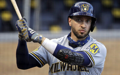 In this July 28, 2020, file photo, Milwaukee Brewers' Ryan Braun warms up on deck during the first inning of a baseball game against the Pittsburgh Pirates in Pittsburgh. (AP Photo/Gene J. Puskar, File)