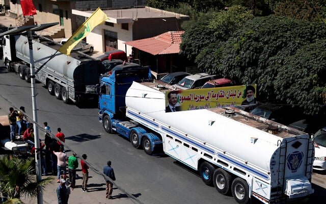 A convoy of tanker trucks carrying Iranian diesel across the border from Syria into Lebanon arrives at the eastern town of al-Ain, Lebanon, on September 16, 2021. (AP/ Bilal Hussein) A convoy of tanker trucks carrying Iranian diesel across the border from Syria into Lebanon arrives at the eastern town of al-Ain, Lebanon, on September 16, 2021. (AP/ Bilal Hussein)