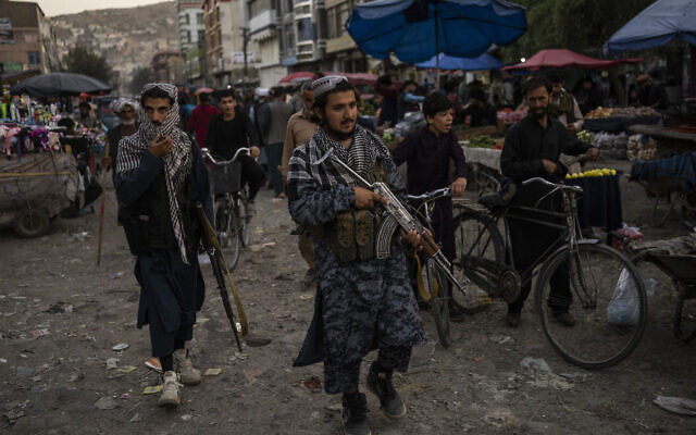 Taliban fighters patrol a market in Kabul's Old City, Afghanistan, on September 14, 2021. (AP Photo/Bernat Armangue)