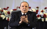 In this April 28, 2014, file photo, Algerian President Abdelaziz Bouteflika, sitting in a wheelchair, applauds after taking the oath as President in Algiers. Former Algerian President Bouteflika, who fought for independence from France in the 1950s and 1960s and was ousted amid pro-democracy protests in 2019 after 20 years in power, has died at age 84, state television announced Friday, Sept. 17, 2021. (AP Photo/Sidali Djarboub, File)
