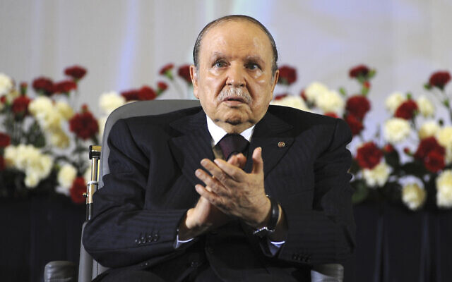 In this April 28, 2014, file photo, Algerian President Abdelaziz Bouteflika, sitting in a wheelchair, applauds after taking the oath as President in Algiers. Former Algerian President Bouteflika, who fought for independence from France in the 1950s and 1960s and was ousted amid pro-democracy protests in 2019 after 20 years in power, has died at age 84, state television announced Friday, Sept. 17, 2021. (AP Photo/Sidali Djarboub, File) In this April 28, 2014, file photo, Algerian President Abdelaziz Bouteflika, sitting in a wheelchair, applauds after taking the oath as President in Algiers. Former Algerian President Bouteflika, who fought for independence from France in the 1950s and 1960s and was ousted amid pro-democracy protests in 2019 after 20 years in power, has died at age 84, state television announced Friday, Sept. 17, 2021. (AP Photo/Sidali Djarboub, File)