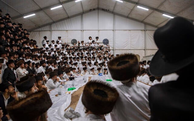 Ultra-Orthodox Jews, members of the Lelov Hassidic dynasty attend the "Pidyon Haben" ceremony for the great grandchild of their chief rabbi Aharon Biderman in Beit Shemesh, Israel, on September 16, 2021. (AP/Oded Balilty)