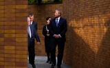 Holland's King Willem-Alexander, right, officially unveiling a new monument in the heart of Amsterdam's historic Jewish Quarter honoring the 102,000 Dutch victims of the Holocaust, September 19, 2021, (AP Photo/Peter Dejong)