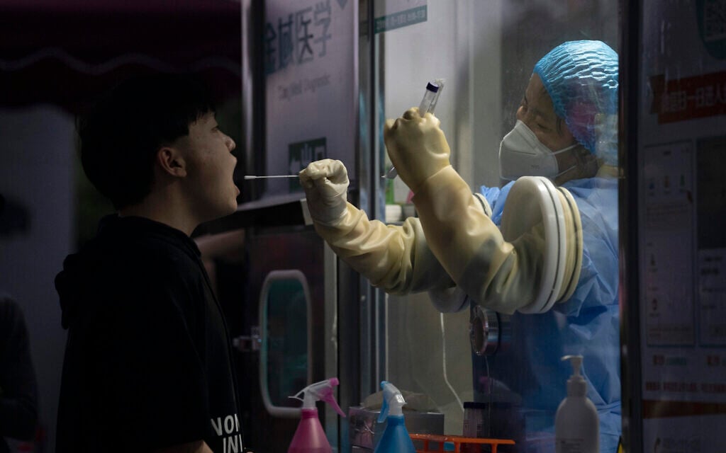 A man gets swapped during a nuclei test for COVID-19 in Beijing Sept. 18, 2021 (AP Photo/Ng Han Guan) A man gets swapped during a nuclei test for COVID-19 in Beijing Sept. 18, 2021 (AP Photo/Ng Han Guan)