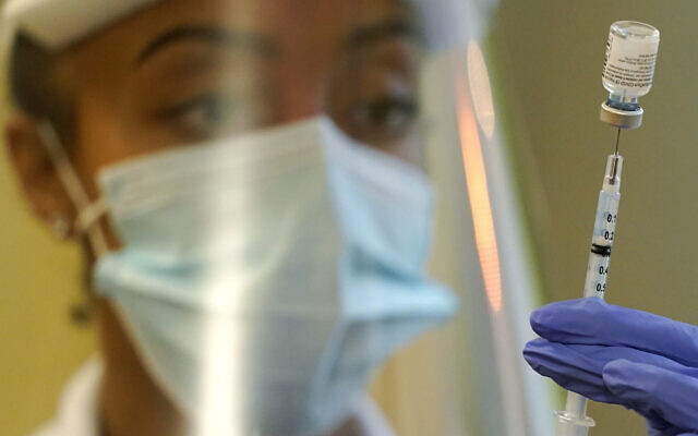 A pharmacist prepares a syringe of the Pfizer vaccine for COVID-19, at Queen Anne Healthcare, a skilled nursing and rehabilitation facility in Seattle, January 8, 2021. (AP Photo/Ted S. Warren, File) A pharmacist prepares a syringe of the Pfizer vaccine for COVID-19, at Queen Anne Healthcare, a skilled nursing and rehabilitation facility in Seattle, January 8, 2021. (AP Photo/Ted S. Warren, File)