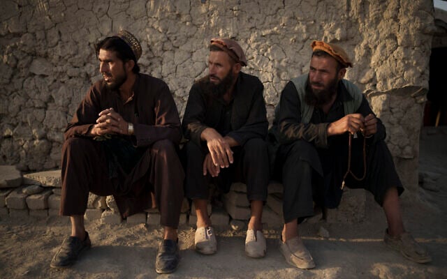 Afghans sit outside a mosque in a poor neighborhood where hundreds of internally displaced people from the eastern part of the country have been living for years, in Kabul, Afghanistan, September 27, 2021. (AP Photo/Felipe Dana) Afghans sit outside a mosque in a poor neighborhood where hundreds of internally displaced people from the eastern part of the country have been living for years, in Kabul, Afghanistan, September 27, 2021. (AP Photo/Felipe Dana)
