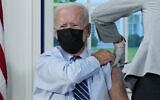 US President Joe Biden receives a COVID-19 booster shot during an event in the South Court Auditorium on the White House campus, Monday, Sept. 27, 2021, in Washington. (AP Photo/Evan Vucci)