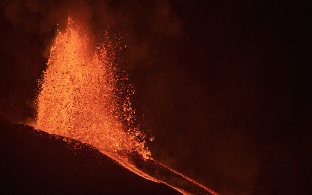 Lava flows from a volcano on the Canary island of La Palma, Spain in the early hours of September 28, 2021. (AP Photo/Saul Santos) Lava flows from a volcano on the Canary island of La Palma, Spain in the early hours of September 28, 2021. (AP Photo/Saul Santos)