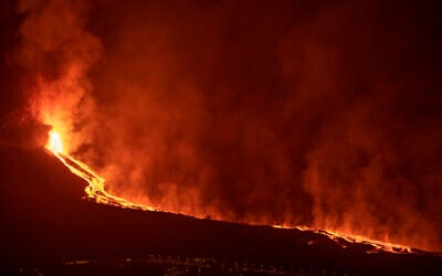 Lava flows from a volcano on the Canary island of La Palma, Spain in the early hours of September 28, 2021. (AP Photo/Saul Santos)