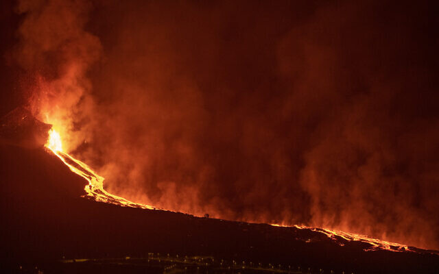 Lava flows from a volcano on the Canary island of La Palma, Spain in the early hours of September 28, 2021. (AP Photo/Saul Santos) Lava flows from a volcano on the Canary island of La Palma, Spain in the early hours of September 28, 2021. (AP Photo/Saul Santos)