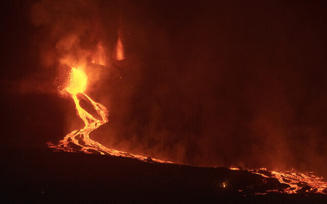 Lava flows from a volcano on the Canary island of La Palma, Spain in the early hours of September 28, 2021. (AP Photo/Saul Santos) Lava flows from a volcano on the Canary island of La Palma, Spain in the early hours of September 28, 2021. (AP Photo/Saul Santos)