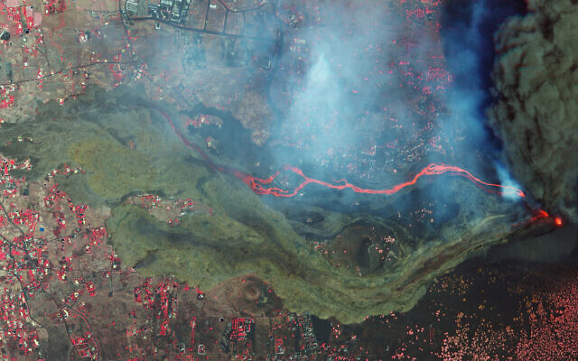 In this September 26, 2021 satellite photo from Planet Labs Inc. lava and ash from a volcano on the Canary island of La Palma, Spain can be seen. (Planet Labs Inc. via AP) In this September 26, 2021 satellite photo from Planet Labs Inc. lava and ash from a volcano on the Canary island of La Palma, Spain can be seen. (Planet Labs Inc. via AP)