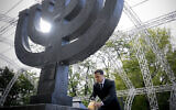 Ukrainian President Volodymyr Zelensky attends a ceremony at the monument to Jewish victims of Nazi massacres, at Babyn Yar, in Ukraine's capital Kyiv, on September 29, 2021. (Ukrainian Presidential Press Office via AP/File)