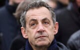 French former president Nicolas Sarkozy attends a ceremony at the Arc de Triomphe in Paris, November 11, 2019. (Ludovic Marin/Pool via AP, file)