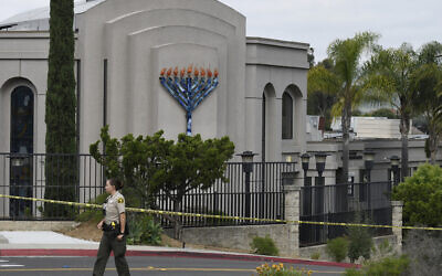 Illustrative: A San Diego County sheriff's deputy stands in front of the Chabad of Poway synagogue, in Poway, California, April 28, 2019. (Denis Poroy/AP)
