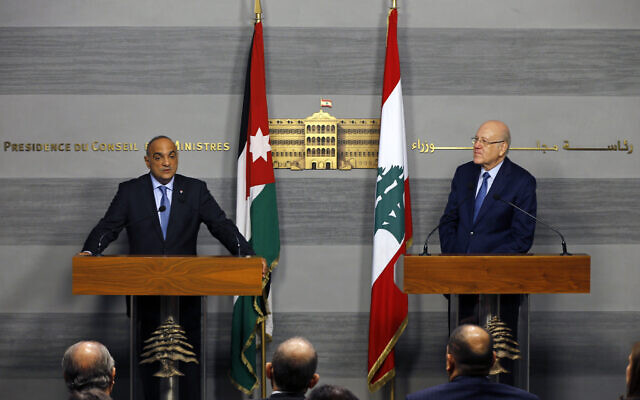 Jordanian Prime Minister Bisher Khasawneh, left, speaks during a joint press conference with his Lebanese counterpart Najib Mikati, at the Government House in downtown Beirut, Lebanon, Thursday, Sept. 30, 2021. (AP Photo/Bilal Hussein) Jordanian Prime Minister Bisher Khasawneh, left, speaks during a joint press conference with his Lebanese counterpart Najib Mikati, at the Government House in downtown Beirut, Lebanon, Thursday, Sept. 30, 2021. (AP Photo/Bilal Hussein)