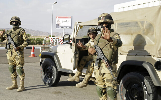 Illustrative: Egyptian soldiers guard the entrance to the Sharm el-Sheikh International Airport as they gesture to a photographer in south Sinai, Egypt, November 2015. (AP Photo/Thomas Hartwell, File) Illustrative: Egyptian soldiers guard the entrance to the Sharm el-Sheikh International Airport as they gesture to a photographer in south Sinai, Egypt, November 2015. (AP Photo/Thomas Hartwell, File)