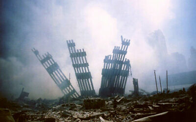 In this September 11, 2001 file photo, the remains of the World Trade Center stands amid the debris following the terrorist attack on the building in New York. (AP/Alexandre Fuchs)