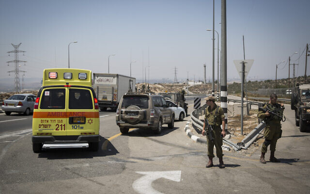 Illustrative: An ambulance and IDF troops are seen on Route 443 near Beit Horon, on August 15, 2015. (Hadas Parush/Flash90) Illustrative: An ambulance and IDF troops are seen on Route 443 near Beit Horon, on August 15, 2015. (Hadas Parush/Flash90)