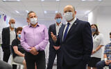 Prime Minister Prime Minister Naftali Bennet (right) and Health Minister Nitzan Horowitz attend a press conference at a Maccabi vaccination center in Holon, on June 29 2021. (Marc Israel Sellem/Pool/Flash90)