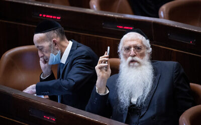 MK Meir Porush, right, in the Knesset, on July 14, 2021. (Yonatan Sindel/Flash90)