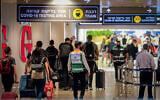 Travelers are seen at Ben Gurion Airport, on July 19, 2021. (Avshalom Sassoni/Flash90)