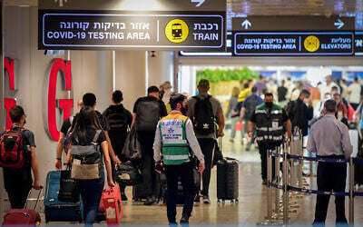 Travelers are seen at Ben Gurion Airport, on July 19, 2021. (Avshalom Sassoni/Flash90)